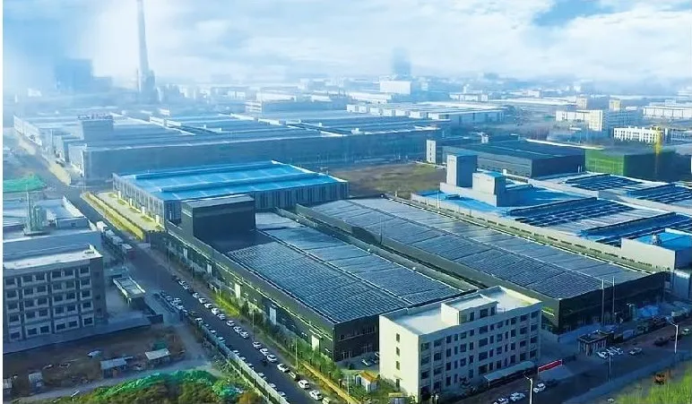 Aerial view of the plant buildings and storage yard.