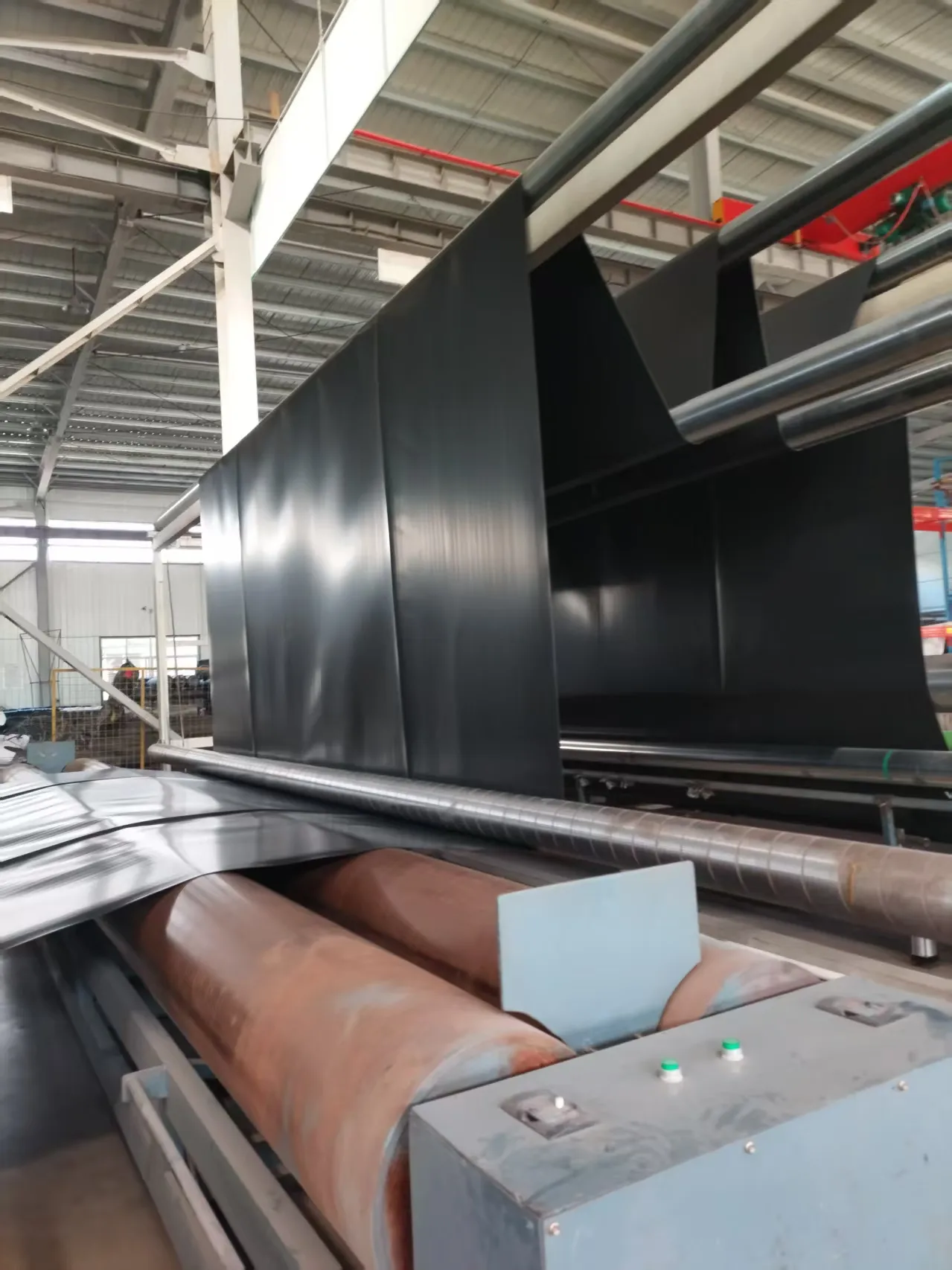 HDPE geomembrane sheet running off the extrusion line.